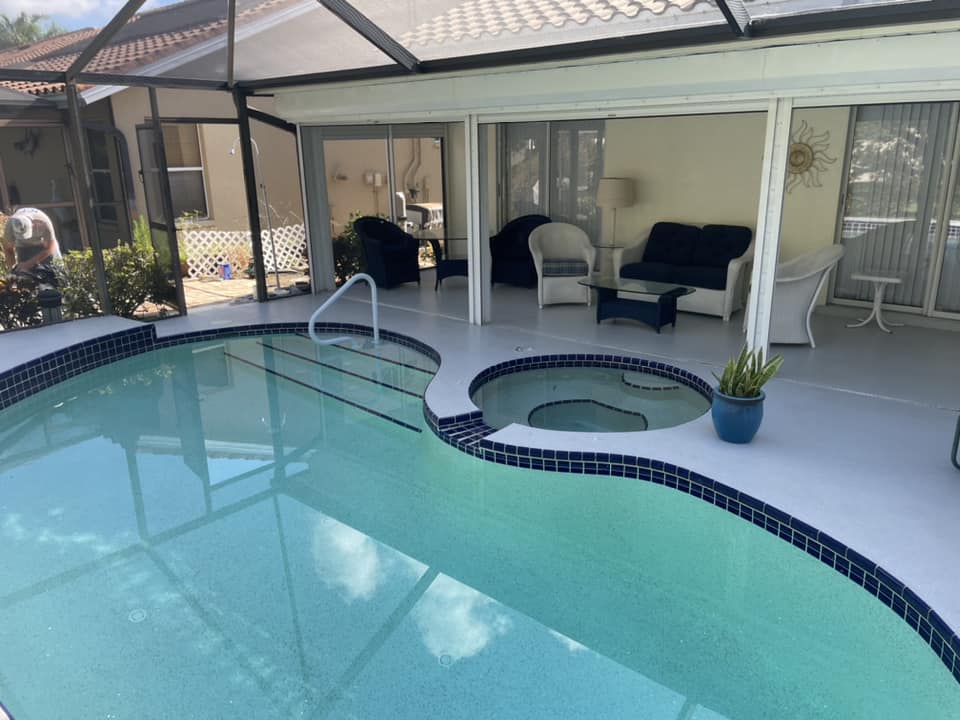 Pool deck coating with spa by Infinity Custom Flooring